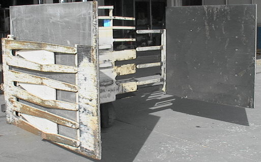 One of 3 Long Reach MFG forklift squeeze box stack handling