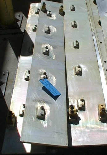 1/2 by 10 by 75" Aluminum plate strip with 7 double stud-nut